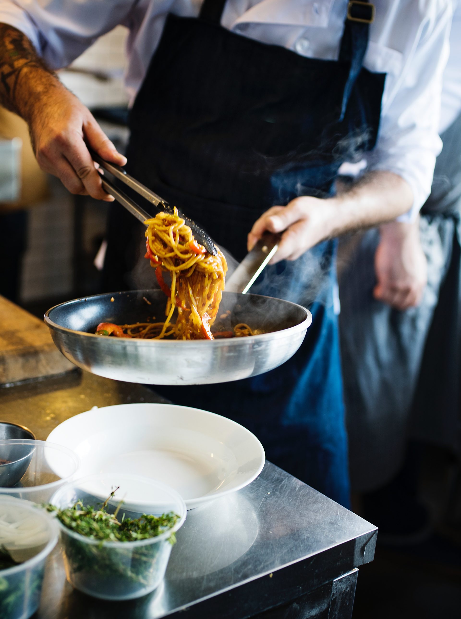 Pasta being served by a chef